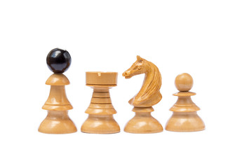 Old chess pieces isolated on white background