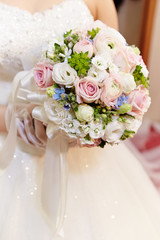 bride holding wedding bouquet
