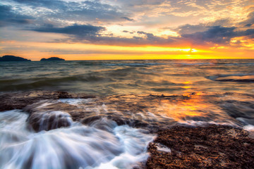 Wave hit the rock fog clouded the water stone the exposure twilight in the sea. beautiful sea rocks. 