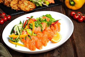 ceviche with fresh vegetables on a white plate