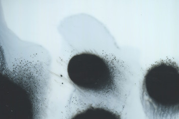 Abstract ink background. Marble style. Black paint stroke texture on white paper. Wallpaper for web and game design. Grunge mud art. Macro image of pen juice. Dark Smear.