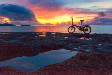 Fototapeta premium Wave hit the rock fog clouded the water stone the exposure twilight in the sea. beautiful sea rocks. 