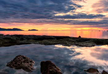 Wave hit the rock fog clouded the water stone the exposure twilight in the sea. beautiful sea rocks. 