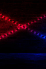Background of an empty corridor with brick walls and neon light. Brick walls, neon rays and glow
