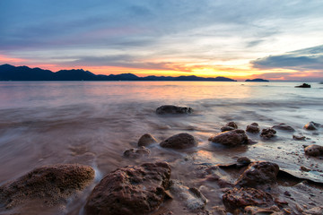 Fototapeta na wymiar Wave hit the rock fog clouded the water stone the exposure twilight in the sea. beautiful sea rocks. 
