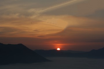 Blurred image of Sunrise, mountain and mist in winter