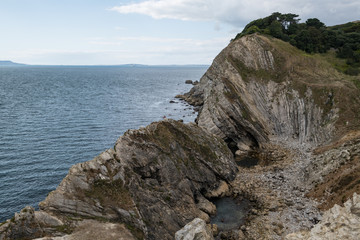 Fototapeta na wymiar Lulworth Cove rock formations on the Dorset coastline