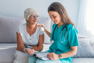 Nurse Visiting Senior Woman For Check Up