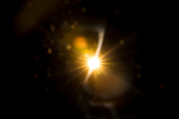 Fototapeta na wymiar Abstract Natural Sun flare on the black background.