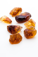 Brown caramelized sugar on white background.