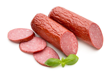 Salami smoked sausage, basil leaves on white background cutout.