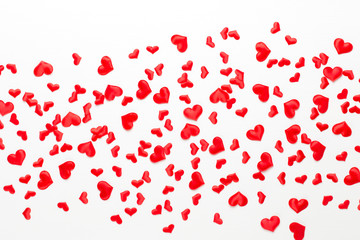 Valentines day background red hearts on wooden background.