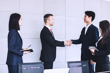 shake hands and successful negotiation of business people