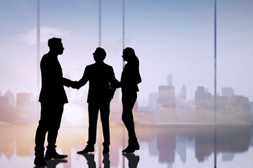 silhouette business people shake hand and negotiation in office, successful discussion concept