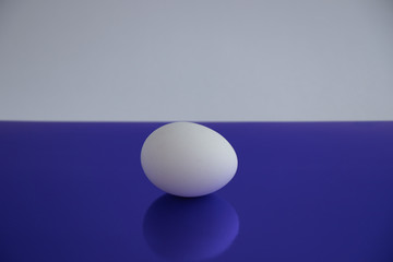 Eggs are white on a blue background.