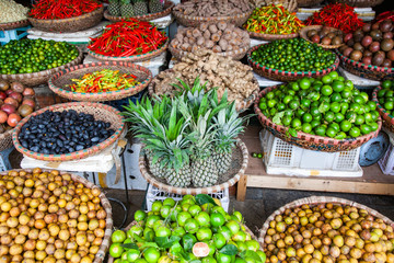 tropical spices and fruits sold at a local market in Hanoi (Vietnam)