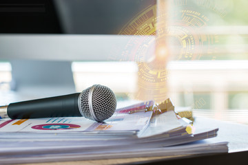 Microphone on paper document at seminar with graphical interface. communication technology for...