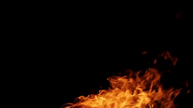 Real fire isolated on black background loop video