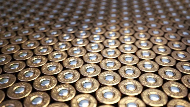Close up of 20 gauge shotgun shell brass bases in a grid