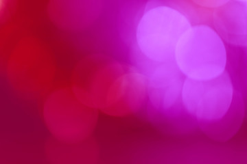Abstract background of red and pink tones with bokeh