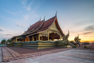 Fototapeta na wymiar Wat Phuproud magical glow at sunset. The only place in the world in Thailand 4/09/2016