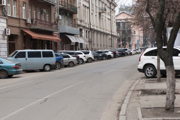 Parking along the road on a street in the center of the Dnipro. Cars parked on the street. Dnipro is the fourth largest city in Ukraine.
