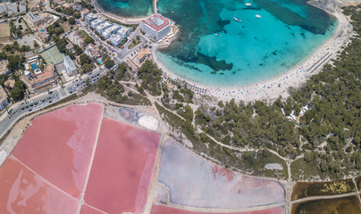 Colonia Sant Jordi, Mallorca Spain. Amazing drone aerial landscape of the pink salt flats and the charming beach Estanys