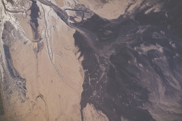 Naklejka premium Aerial view of degraded landscape. Destroyed land. View from above. Industrial place. Photo captured with drone.