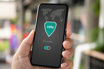 man hand holding phone with app vpn private network