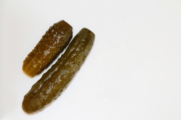 Two pickled cucumbers (commonly known as a pickle or gherkin) isolated on white background and space for your text