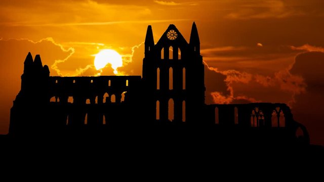 Whitby Abbey Castle at Sunset, a Ruined Benedictine monastery sited on Yorkshire, England, UK. The Gothic church which Inspired Bram Stoker to write his most Famous Novel Dracula