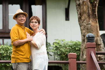 Fototapeta premium Image of happy romantic Asian senior couple outdoor in park