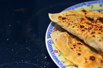 products of thin dough, baked with meat on a plate , fragment, oriental cuisine, traditional food, restaurant