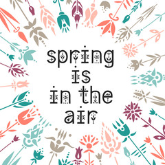 Fototapeta na wymiar Lettering poster Spring Is In The Air inside the floral wreath