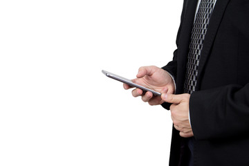 Businessman in Black Suit and Tie Holding Smartphone in Hand And Typing a Message Against White Background