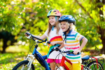 Kids on bike. Children on bicycle. Child biking.