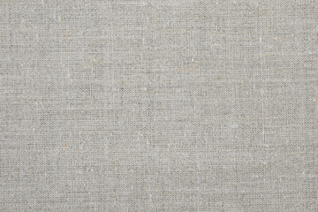 Fototapeta na wymiar texture of rough linen fabric gray color, closeup