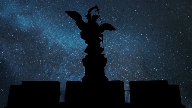 Rome: Bronze statue of Michael the Archangel by Night with Stars in Background, standing on top of the Castel Sant'Angelo or Castle of the Holy Angel (Mausoleum of Hadrian), Italy, Europe
