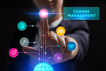 The concept of business, technology, the Internet and the network. A young entrepreneur working on a virtual screen of the future and sees the inscription: Change management
