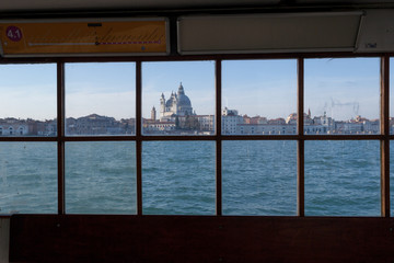 Waiting the ferry boat on the Giudecca. View of the Canal Grande and the Gesuati church from the pier window