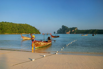 Longtail boats anchored at Ao Loh Dalum beach on Phi Phi Don Island, Krabi Province, Thailand