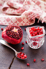 Ripe red grenade on a wooden background