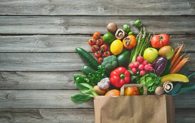 Fotobehang Shopping bag full of fresh vegetables and fruits © Alexander Raths