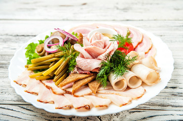 Sliced from bacon on a white plate. Rose from fat. Lard chopped with black bread, mustard, onion, close-up fermented food and copy space
