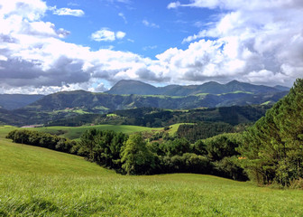 Mountains of the Pais Basco, Spain, under a sunny blue sky on the way to Santiago de Compostela