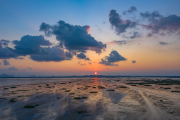 scenery sunset above the wetlands. Talay Noi is the second of largest lake in Thailand. the lake is an abundant food a source for .waterfowl habitat a source of sea food.