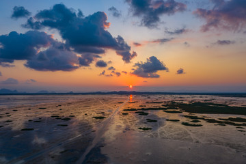 scenery sunset above the wetlands. Talay Noi is the second of largest lake in Thailand. the lake is an abundant food a source for .waterfowl habitat a source of sea food.