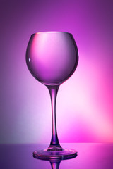 Glass of water on a colored background