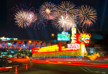 The Chinese New Year 2019.Nakhon Sawan Thailand dragon adorned with lights on the road bridge over the fireworks 28/01/2019