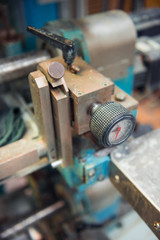 A blue old vintage relic Industrial Pipe Valve cog wheel, a wheel to turn and release pressure for gas an hydraulic industrial production.